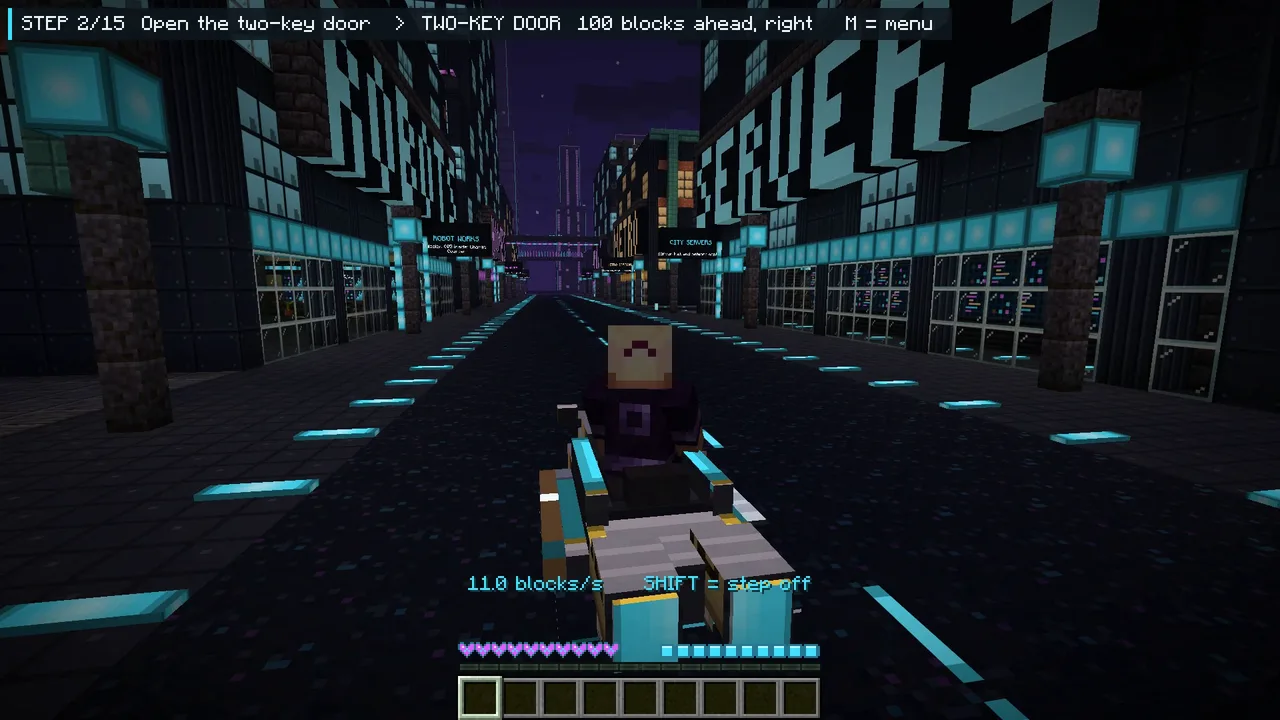 Real in-game capture: riding the hover bike down Circuit Avenue at night between neon block letters.